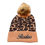Beanie with leopard print top and 'Rodeo' text on a white background