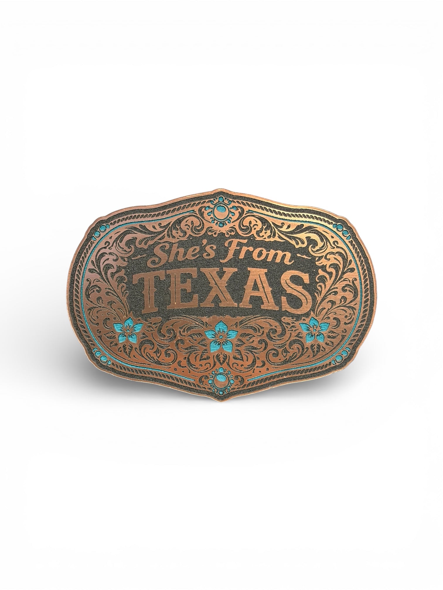 Belt buckle with 'She's from Texas' text on a white background