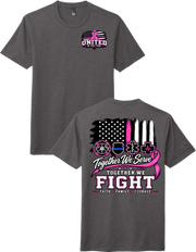 A dark gray heather t-shirt shown from both the front and back. The front features a small pink and white 'United in Care' ribbon and flag graphic on the left chest.