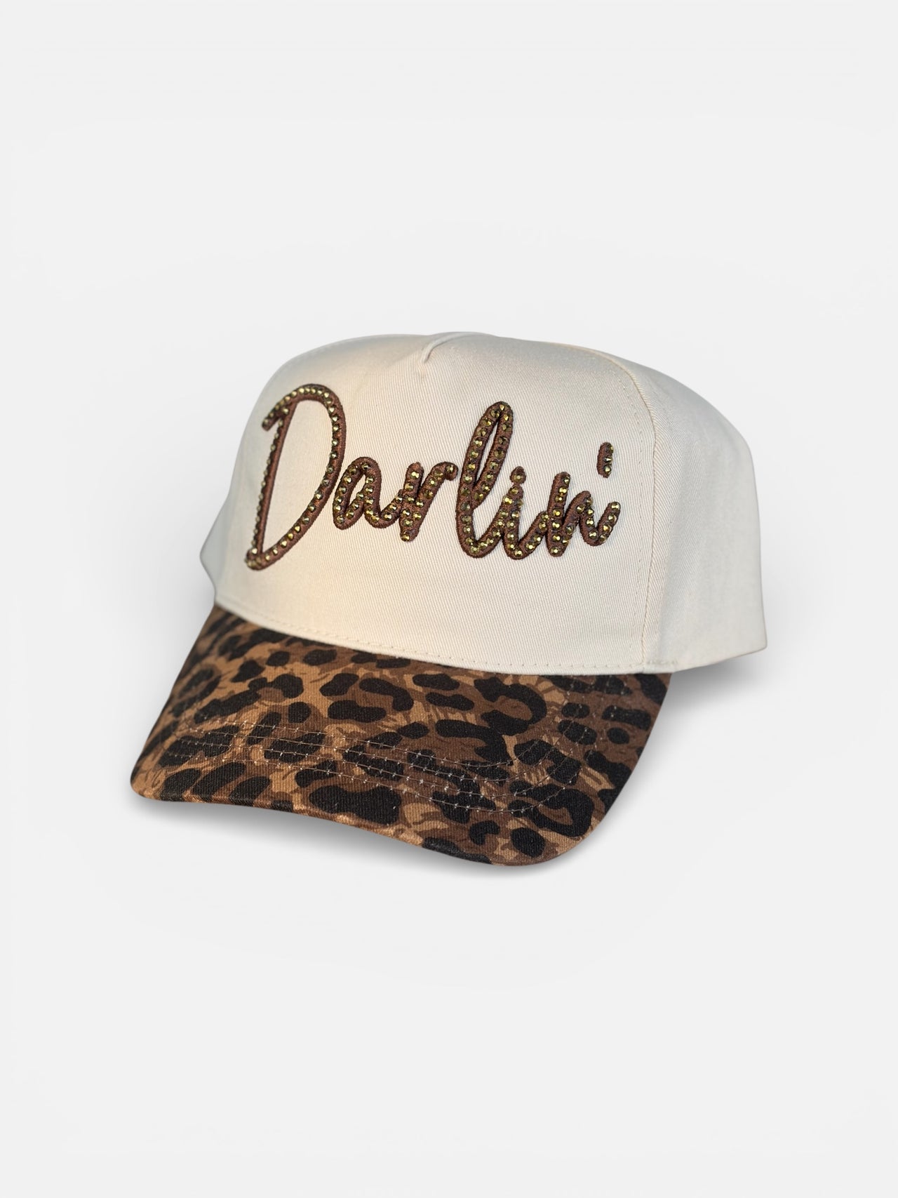 Cap with 'Darlin' text and leopard print brim on a white background