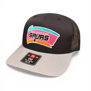 Black and beige cap with San Antonio Spurs logo on a white background